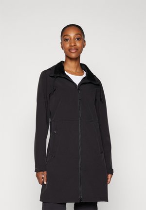 Black softshell coat with a zippered front, drawstring hood, and faux fur collar. Features side pockets and a tailored, mid-length design.