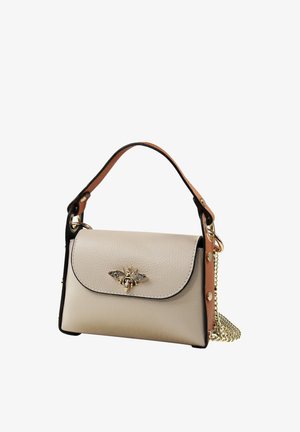 Cream textured handbag with black trim, a brown top handle, gold bee emblem on flap, and a gold chain shoulder strap.