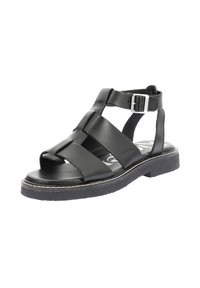 Sandales en cuir noir avec plusieurs brides croisées, boucle de cheville réglable et semelle en caoutchouc texturée avec détail de surpiqûre blanche.