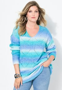 Maglione leggero a maglia con sfumature di blu e motivi a cuore. Design a V, vestibilità oversize, maniche lunghe e polsini a costine.