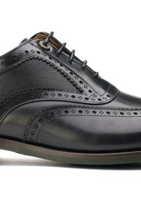 Black leather dress shoe with brogue detailing, featuring a smooth texture, rounded toe, and six lace-up eyelets for fastening.