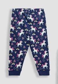 Tengerészkék pamut leggings, amelyet megismétlődő egyszarvú minta díszít; rózsaszín sörények, szivárványok és virágok találhatók rajta. Rugalmas derékpánttal és szűkített szárakkal a bokáknál.