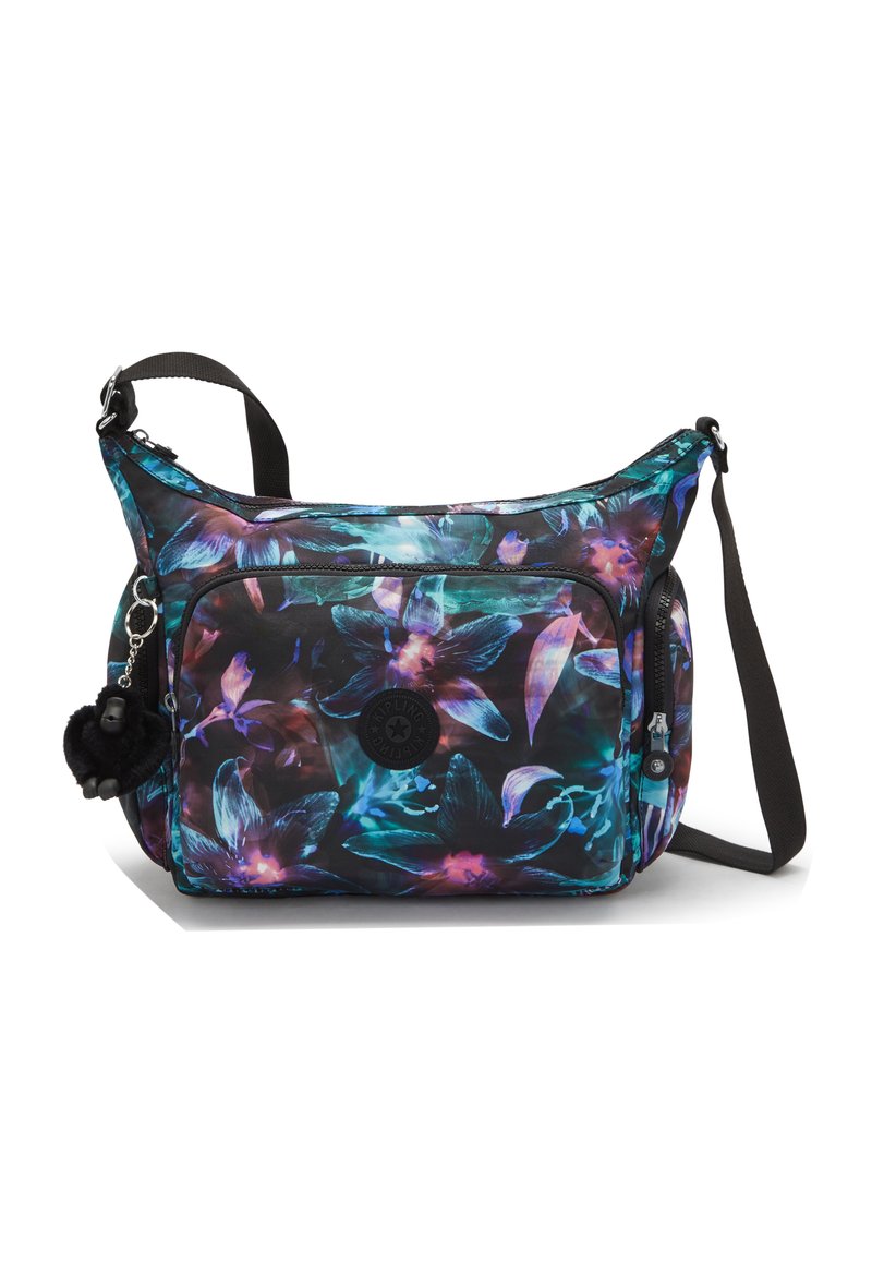 Shoulder bag with floral pattern in blue, purple, and black. Features adjustable strap, zippered pockets, and a fur pom-pom charm.