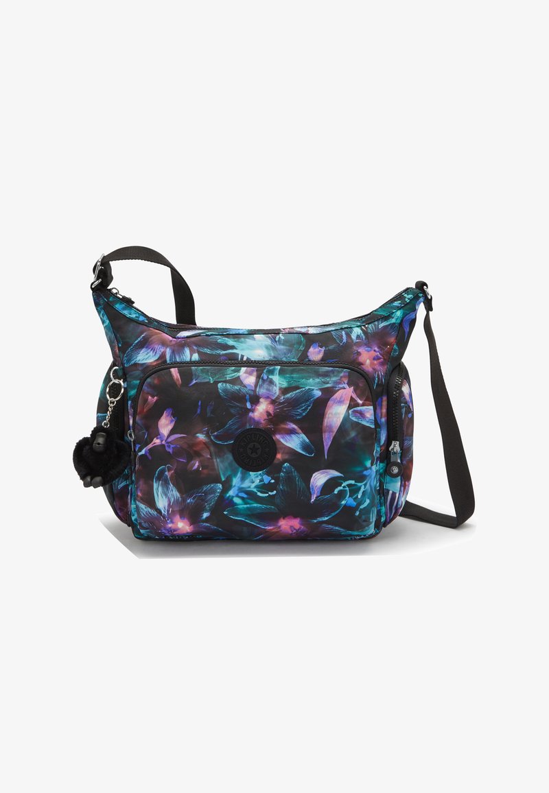Shoulder bag with floral pattern in blue, purple, and black. Features adjustable strap, zippered pockets, and a fur pom-pom charm.