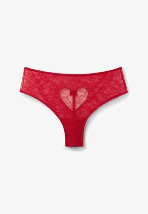 Red lace thong featuring a heart-shaped cutout and floral pattern. Soft texture with contrasting waistband, designed for a revealing fit.