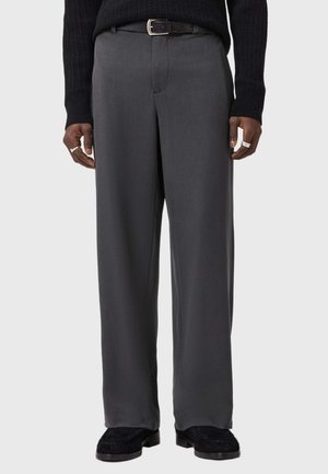 Gray tailored trousers with a straight fit, made from smooth fabric. Features a belt, side pockets, and a clean front crease.