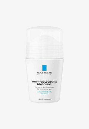 Weißer zylindrischer Behälter mit einem weißen Deckel, beschriftet mit "24H Physiologisches Deodorant", 50 ml, in blauer und schwarzer Schrift.