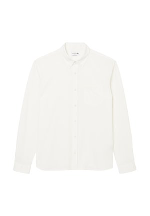 Chemise blanche à manches longues avec boutonnière, dotée d'un col classique, d'une poche poitrine unique, et d'un logo de marque minimaliste en broderie légère.
