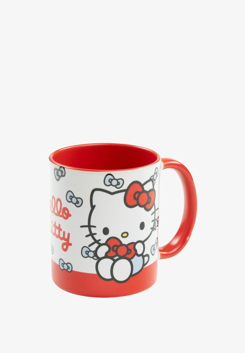Ceramic mug with a white exterior featuring a Hello Kitty illustration, red interior, and handle. Red accents with small bow patterns.
