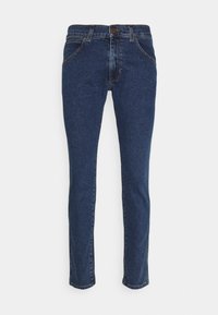 Jeans in denim blu scuro con una vestibilità slim, dotati di chiusura a bottone, cinque tasche e cuciture a contrasto lungo le cuciture.