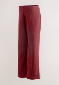 Burgunderrøde bukser med vide ben i blødt stof med en glat tekstur. Har en cremefarvet stribe i siden og elastik i taljen for komfort.
