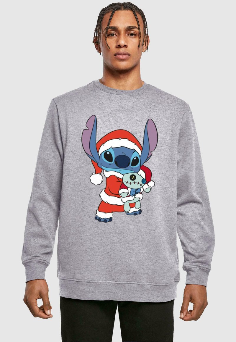Felpa grigia con un personaggio dei cartoni animati in un costume da Babbo Natale rosso, che tiene un giocattolo azzurro. Tessuto morbido con polsini e orlo a coste.