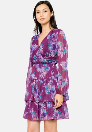 Purple floral dress with long sleeves, pleated tiers, and a wrap style. Features a mix of blue and pink flowers on a semi-transparent fabric.