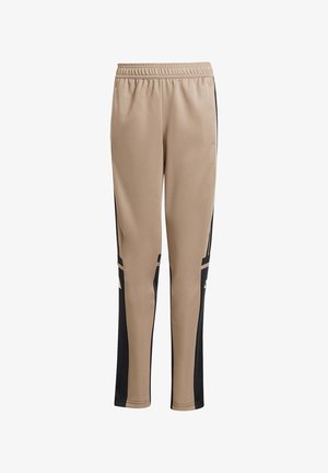 Beige sportbroeken met zwarte zijpanelen en gouden accenten, voorzien van een elastische tailleband en een taps aflopende pijpdesign.