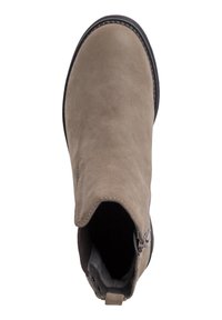 Beige mokasini nilon sandaali koje sondo mkueso, na mside lado wa elastiki na mchini mweusi. Ina vipengele vyenye kushoneka kwa busara na texture laini, isiyo na mng'aro.