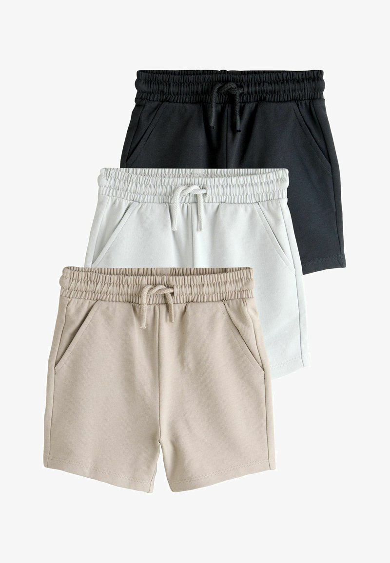 Three pairs of shorts in black, white, and beige. Each features an elastic waistband, drawstring, and side pockets. Soft fabric texture.