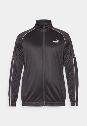 Black zip-up jacket with a high collar, made of smooth fabric. Features white piping along the seams and a small white logo on the chest.