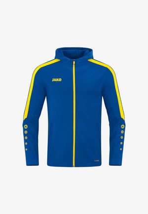 Veste bleue avec des accents jaunes, dotée d'une fermeture éclair, d'une capuche et de détails à boutons sur les manches. Fabriquée en tissu lisse et flexible.