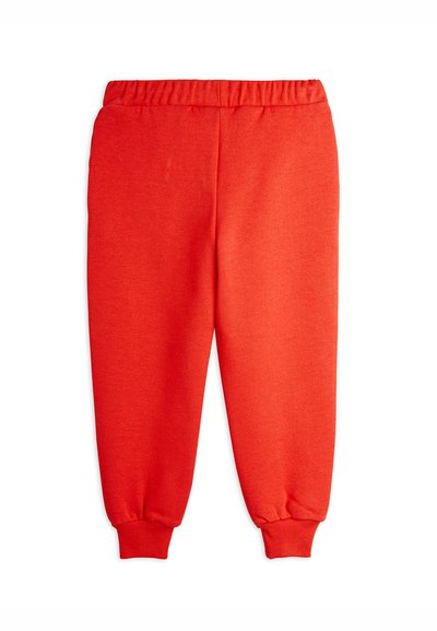 Pantaloni sportivi rossi in cotone con cintura elasticizzata e polsini. Texture liscia e vestibilità comoda, progettati per il massimo comfort e libertà di movimento.