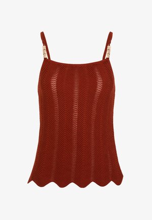 Rust-colored knitted sleeveless top with thin straps featuring gold decorative accents and a scalloped hem.