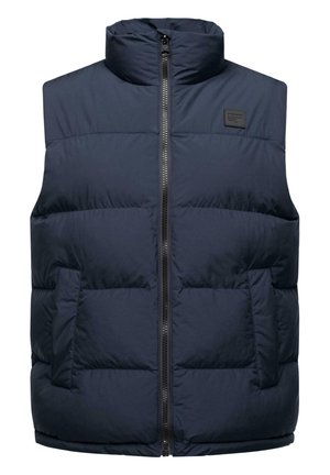 Marineblauer Steppweste mit hohem Kragen, durchgehendem Reißverschluss und zwei seitlichen Taschen. Verfügt über eine gesteppten Textur und ein schwarzes Logo-Patch.