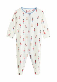 Weißer Babystrampler mit einem wiederholten Muster aus Wachen, gestreiften Hemden und Hunden. Mit blauen Verzierungen und Druckknopfverschlüssen.