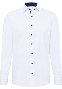 Witte blouse met lange mouwen en een geplooide kraag, navy stippen interieur en navy knopen aan de voorkant. Bevat een borstzak.