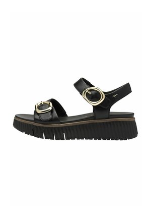 Černé kožené sandály s nastavitelnými popruhy, detailem zlaté přezky a silnou, vroubkovanou černou podrážkou pro lepší přilnavost a pohodlí.