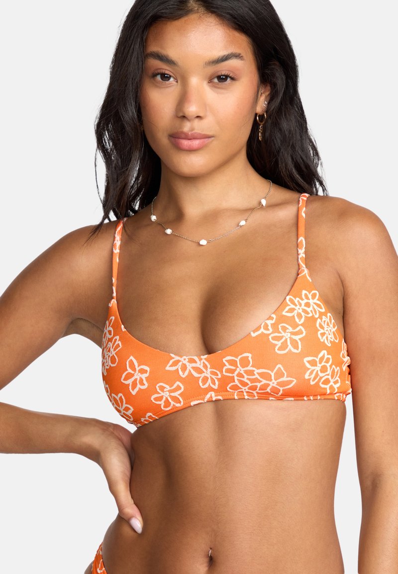 Orange bikini with white floral pattern, adjustable thin straps, and a triangular shape. Soft fabric with stretch and smooth texture.