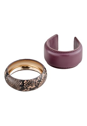 Two bracelets, one with purple leather cuff style and one with a snakeskin pattern and gold interior.