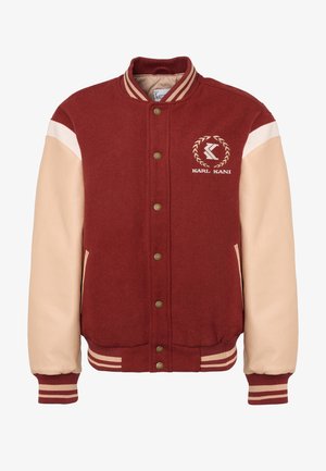 Weinrote Collegejacke mit beigen Lederärmeln, gerippten Bündchen und Kragen. Mit Logo auf der Brust und Messing-Druckknöpfen.