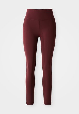 Burgunderfargede leggings laget av strekkbart materiale med høy midje. Sømløst design, kroppsnær fasong og jevn tekstur gjennom hele.