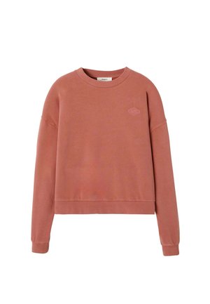 Sweat-shirt court à manches longues couleur rose poussière, en tissu doux, avec un col rond et un logo discret brodé sur la poitrine.