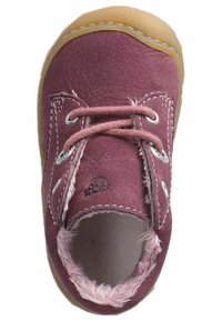 Child's shoe in burgundy leather with pink lace, featuring metal eyelets and a tan rubber sole. Interior lined with soft pink fur.