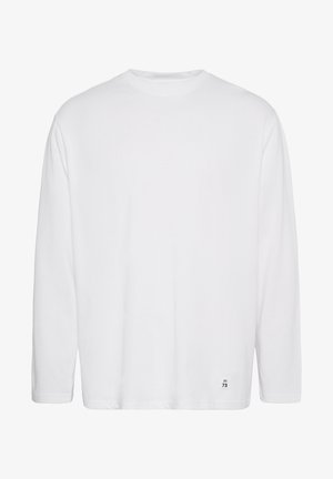 Weißes Langarm-T-Shirt aus Baumwolle. Mit Rundhalsausschnitt, geradem Schnitt und kleinem bedrucktem Logo an der unteren Seite. Glatte Textur.