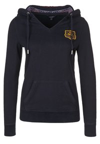 Marinblå hoodie med v-ringning, dragsko, framficka och ett inre mönstrat foder. Har en broderad logotyp på bröstet.