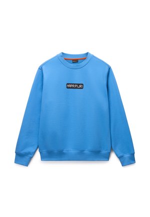 Blauer Pullover aus weichem Stoff mit rundem Halsausschnitt und gerippten Bündchen. Auf der Vorderseite befindet sich ein schwarzes Logo-Patch.