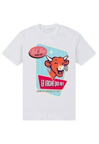 T-shirt bianco in cotone con una grafica colorata di una mucca sorridente. Il testo include "La vache qui rit" in caratteri in grassetto.