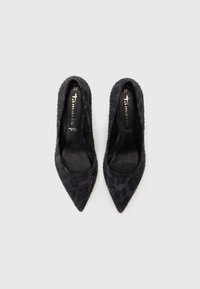 Pair of black pointed-toe women's flats with subtle glitter details and brand name "Tamaris" inside, size 37.