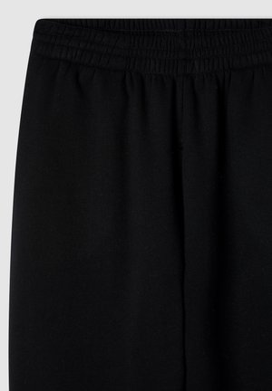 Pantaloni da jogging neri con vita elasticizzata, texture del tessuto morbida e un design semplice a gamba dritta senza ulteriori motivi o accenti.