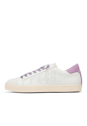 White low-top sneaker with perforated number design on the side, purple laces, and purple suede heel tab on a cream sole.