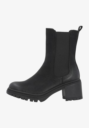 Bottine noire à talon épais, en cuir lisse avec des panneaux latéraux élastiques pour un enfilage facile. Semelle en caoutchouc texturée.