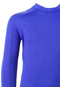 Protection anti-éruption à manches longues en bleu roi uni, fabriquée en tissu extensible ; dotée d'un col montant, de coutures plates et d'un logo sur l'épaule.