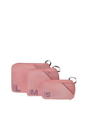 Three pink mesh packing cubes in small, medium, and large sizes with top handles and labeled with size letters.