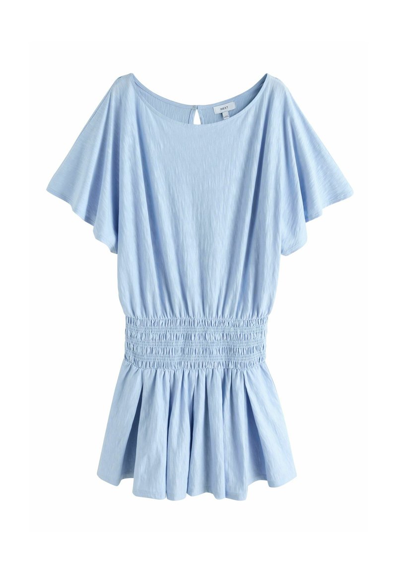 Blouse bleu clair avec larges manches courtes, taille élastiquée froncée et ourlet évasé style peplum.