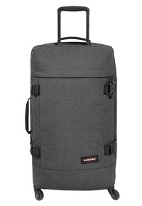 Black fabric wheeled suitcase with a retractable handle, side buckles, and spinner wheels. Simple rectangular design with a textured finish.