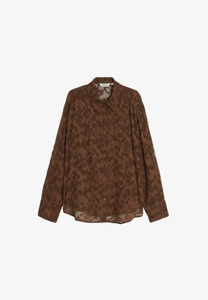 Ruskeakuviollinen pitkähihainen paita, joka on valmistettu läpikuultavasta materiaalista. Siinä on klassinen kaulus ja napitettava etuosa, sekä rento istuvuus.