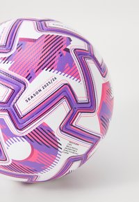 White soccer ball featuring a geometric design with pink and purple accents, textured surface, and identifiable branding details for season 2025/26.