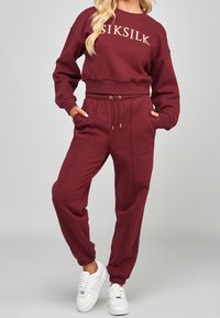 SIKSILK Pantaloni sportivi - red