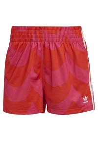 Red and pink patterned athletic shorts with an elastic waistband and white side stripes featuring the Adidas logo in the lower right corner.